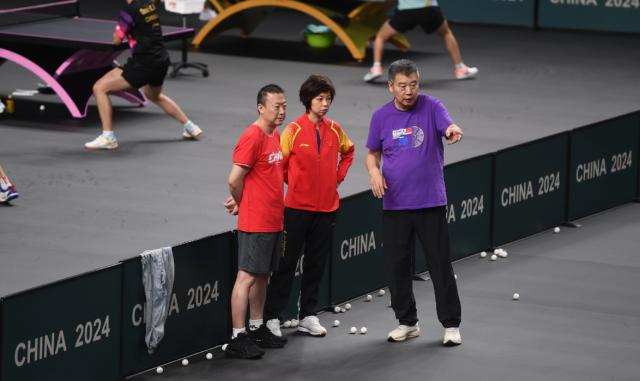 ac米兰体育官网-张怡宁邓亚萍王楠分享备战经验 助力国乒女队集训